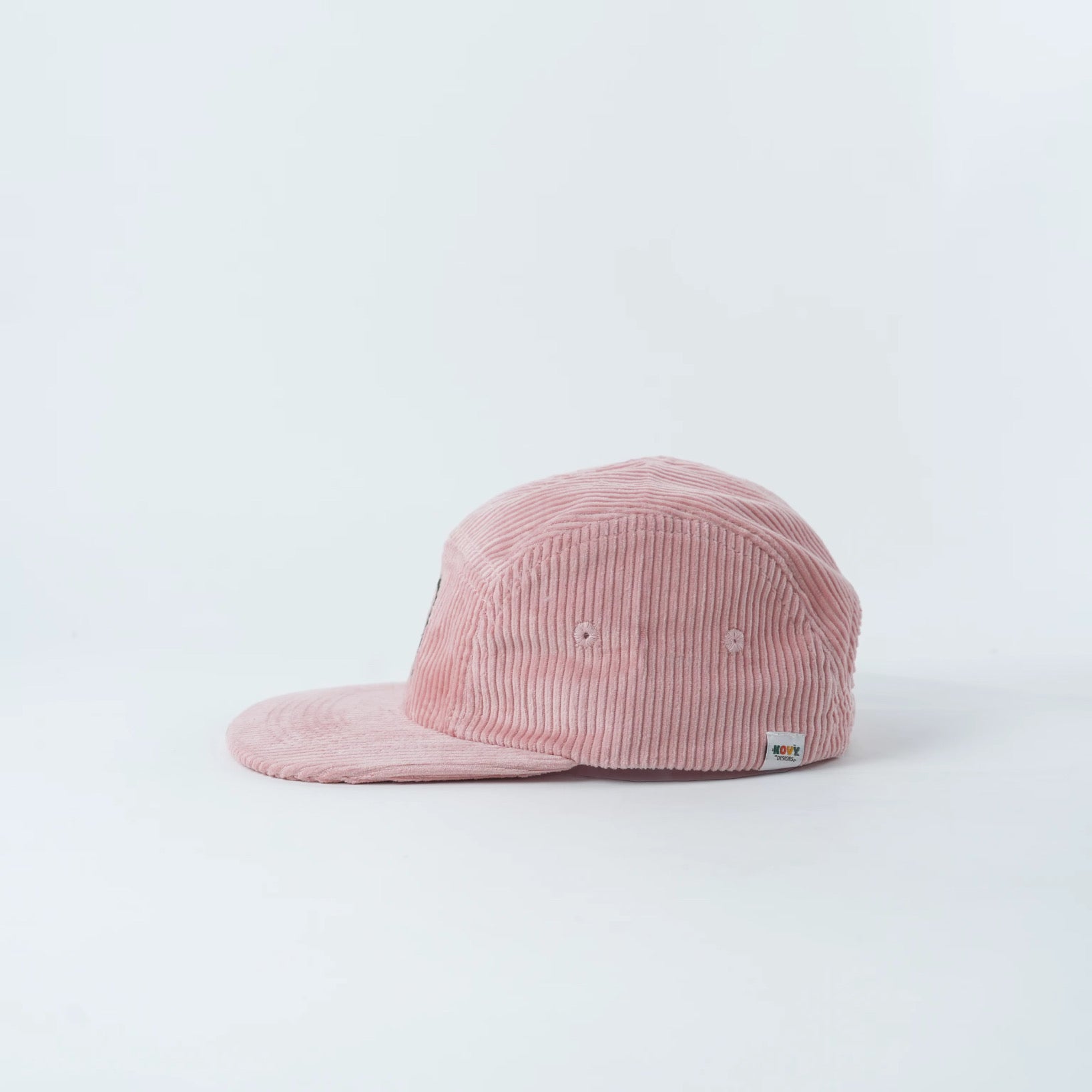 Pink kids corduroy hat with a rainbow design 